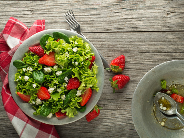 Healthy,Green,Salad,With,Strawberry,And,Fresh,Cheese,On,Wooden