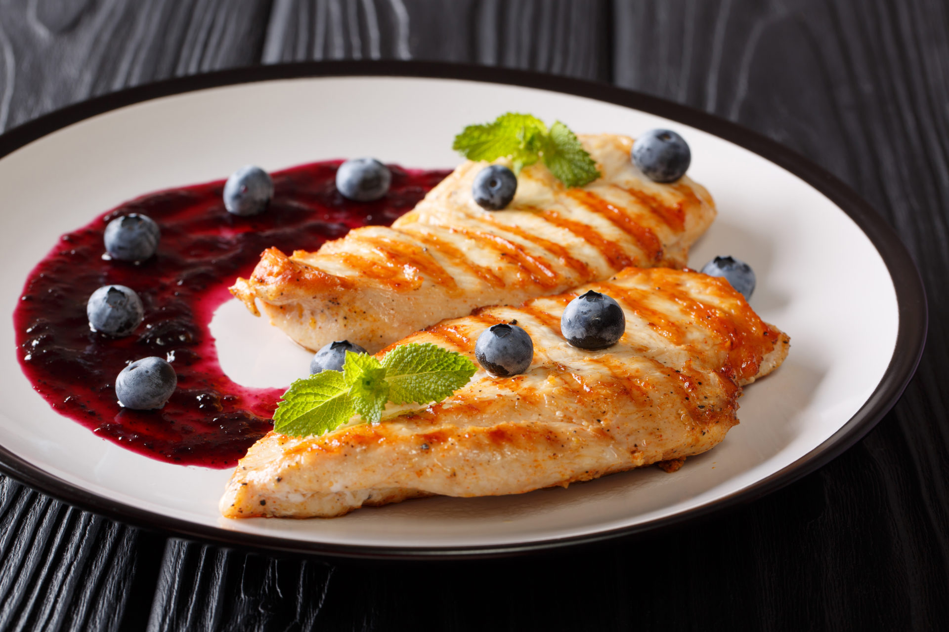 Freshly,Cooked,Grilled,Chicken,Breast,With,Berry,Sauce,And,Mint