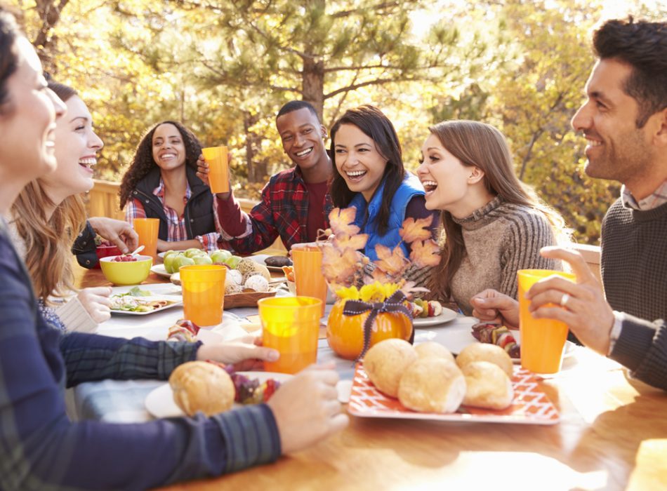 Group,Of,Happy,Friends,Eat,And,Laugh,At,A,Table