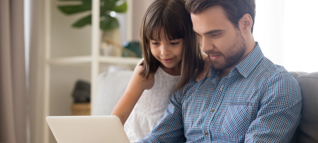 Father,And,Kid,Girl,Using,Laptop,At,Home,Looking,At