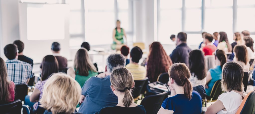 Business,And,Entrepreneurship,Symposium.,Female,Speaker,Giving,A,Talk,At