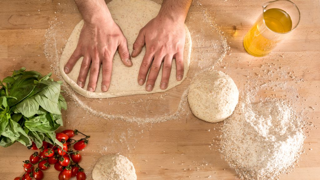 Hands,Knead,The,Dough,For,Pizza,Making