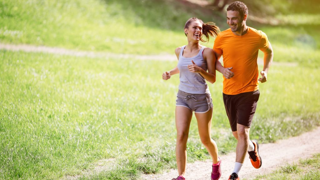 Couple,Jogging,And,Running,Outdoors,In,Nature