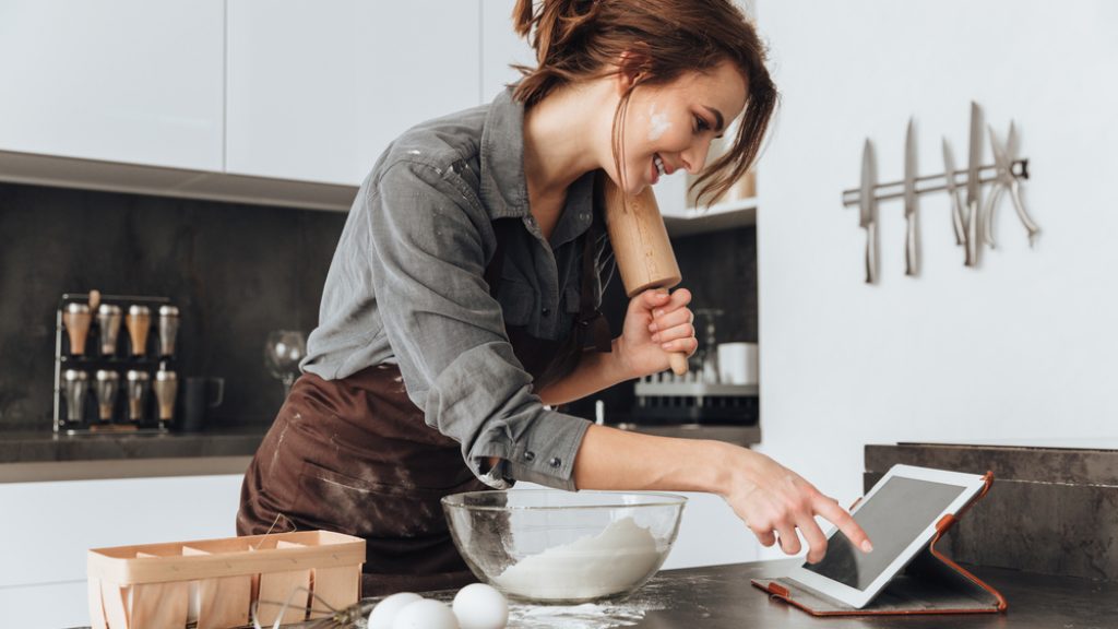 Image,Of,Young,Pretty,Lady,Standing,In,Kitchen,And,Cooking