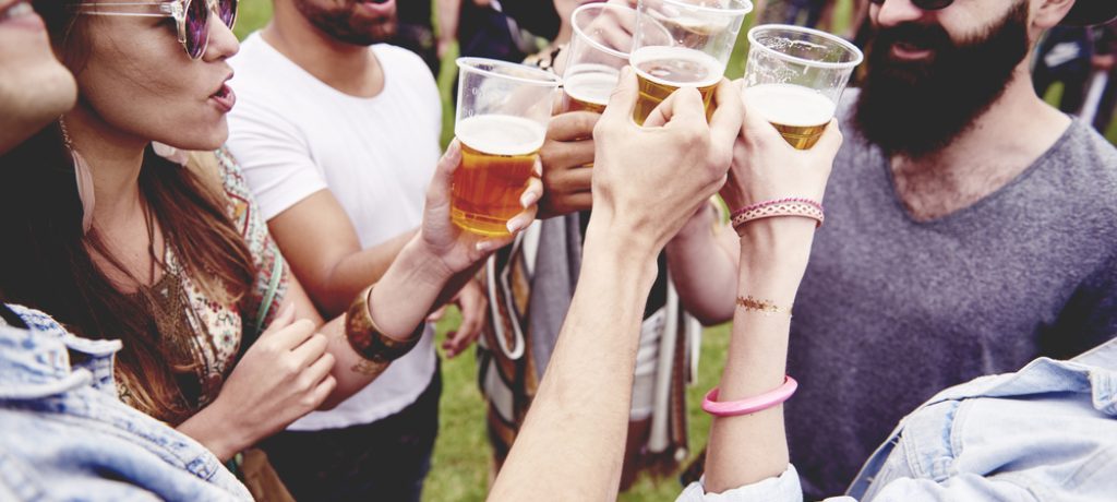 Group,Of,Friends,Drinking,A,Beer,At,The,Festival